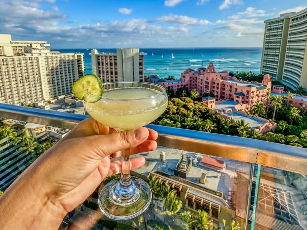 Cocktail with a view of the ocean and Waikīkī skyline at SKY Waikiki.