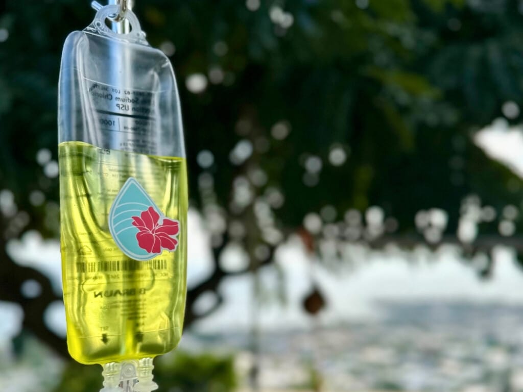 An IV drip in an outdoor setting.