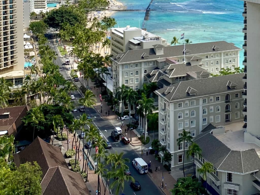 An aerial view of Kalākaua Avenue, featuring the historic Moana Surfrider.