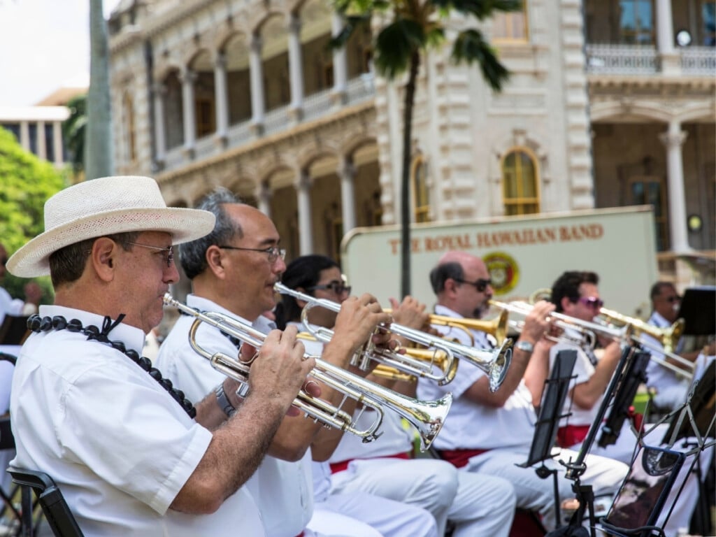 The Royal Hawaiian Band performing on the grounds on ʻIolani Place in Honolulu.