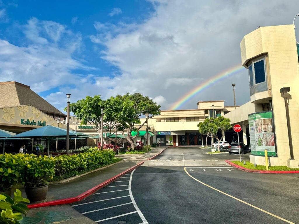 The Starbucks entry of Kahala Mall in Kahala, with a rainbow in the background over the parking structure.