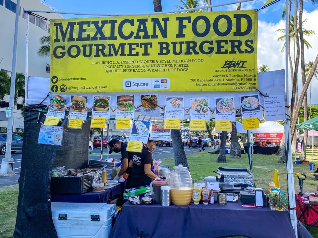 Mexican food gourmet burger stand at Honolulu Farmers Market, offering handmade burgers, sandwiches, and specialty plates.