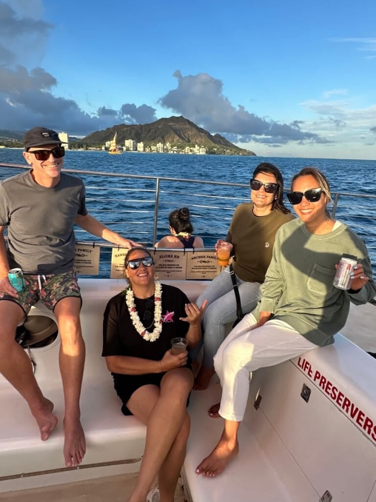 Ashlee & Keliʻi with friends on the Holokai catamaran sunset sail with open bar off the coast of Waikīkī.