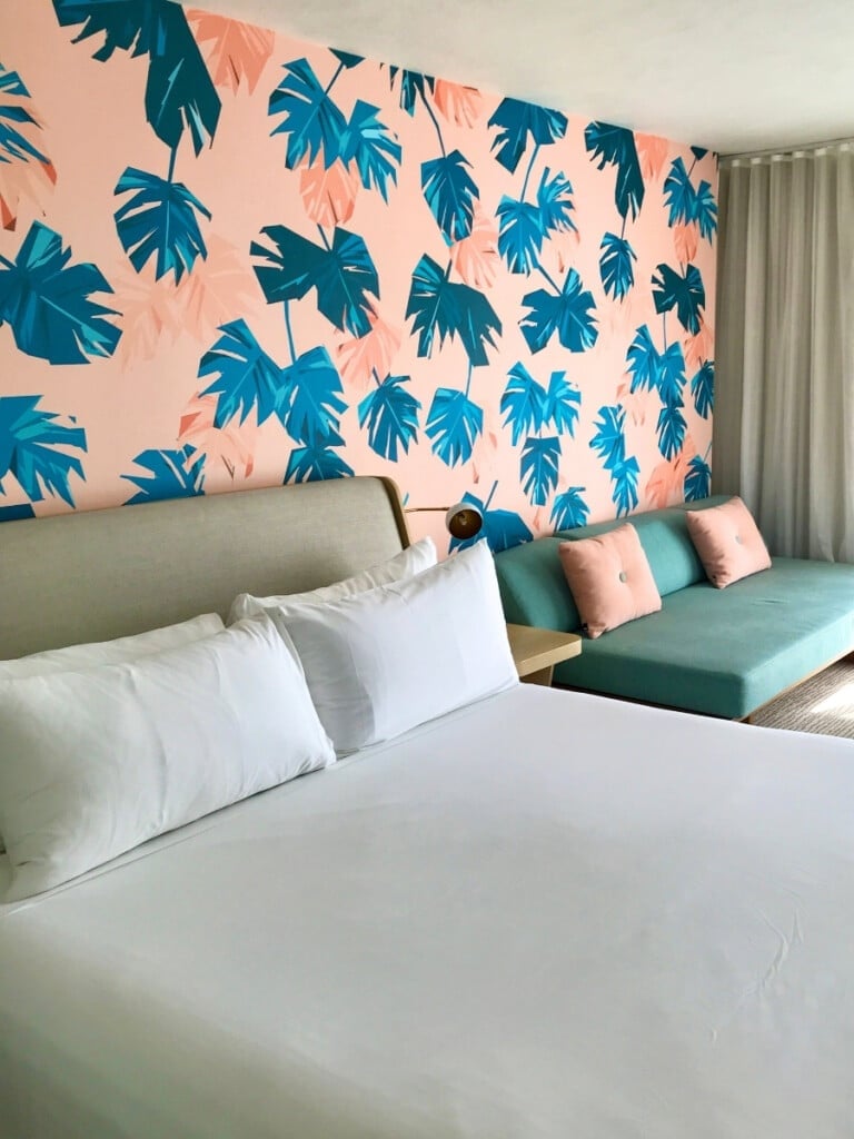 The cute pink and blue wallpapered hotel rooms at The Laylow Hotel.