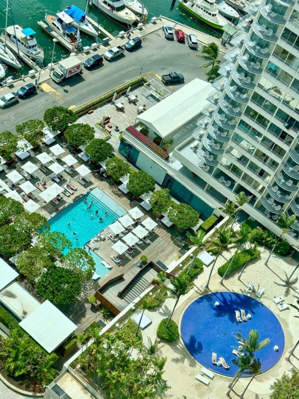 An aerial view of the two swimming pools at Hilton Vacation Club The Modern Honolulu.