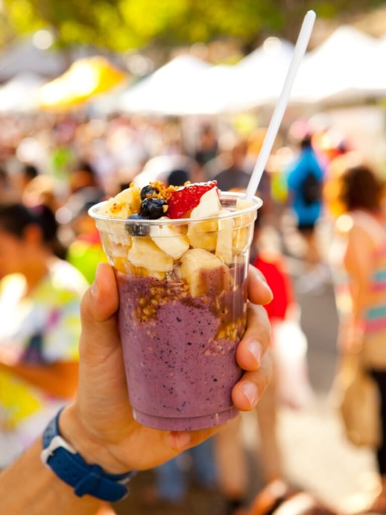 Enjoying a cup of açaí at the KCC Farmers Market in Diamond Head, Oʻahu, Hawaiʻi.