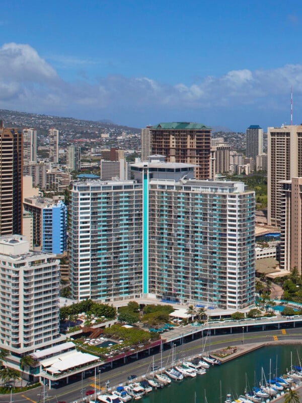 An aerial of Ilikai Hotel & Luxury Suites on the Ala Wai Boat Harbor in Waikīkī