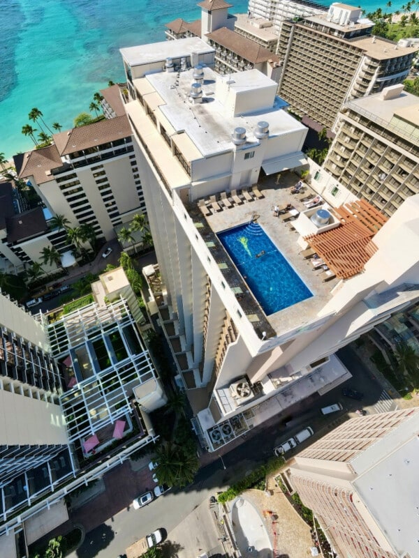 An aerial of The Imperial Hawaiʻi Resort featuring the rooftop swimming pool.