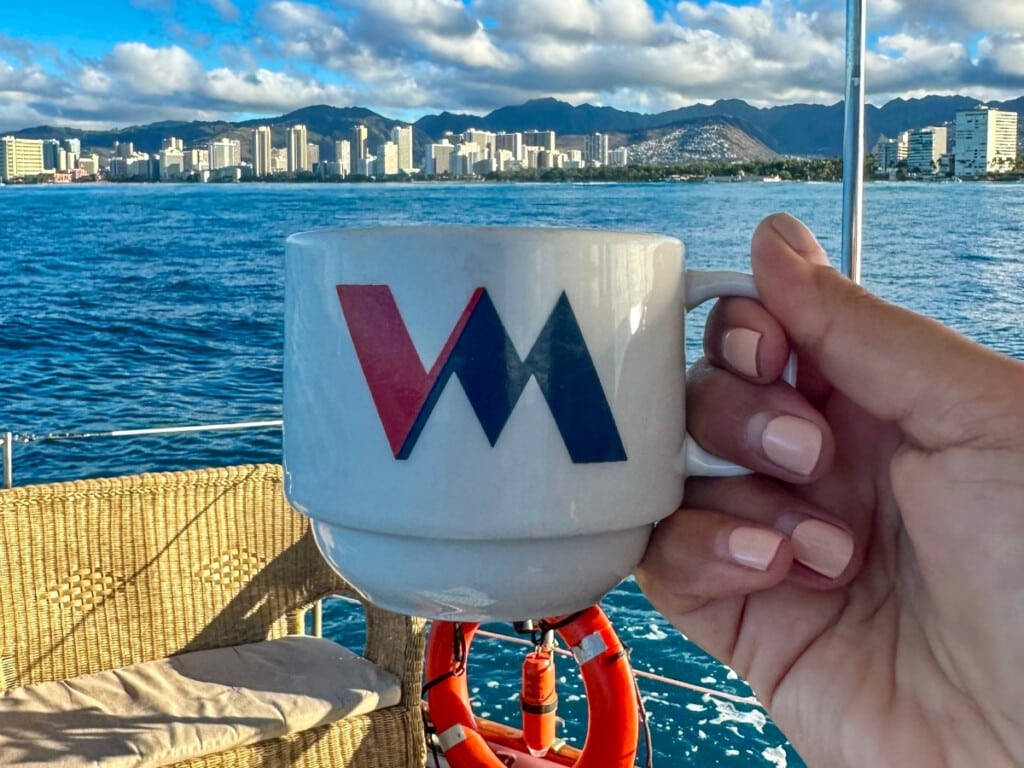 Drinking a cup of coffee aboard the Vida Mia Morning Coffee Cruise of Waikīkī.