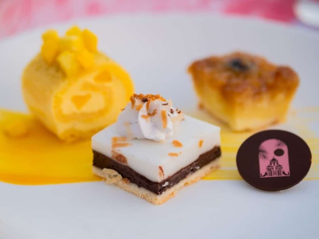 Plate of Chocolate Haupia Pie, Mango Roll, and Pineapple Upside Down Cake at Ahaʻaina Luau at the Royal Hawaiian Resort.