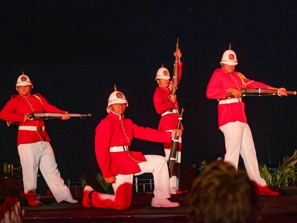 Performers dressed as traditional Hawaiian guards showcased their skills by spinning and twirling rifles during the Ahaʻaina Luau at the Royal Hawaiian.