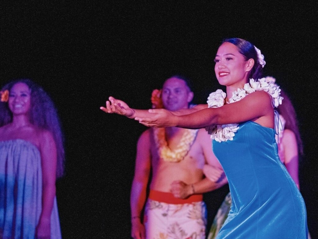 A graceful hula dancer performs at the Ahaʻaina Luau at the Royal Hawaiian.