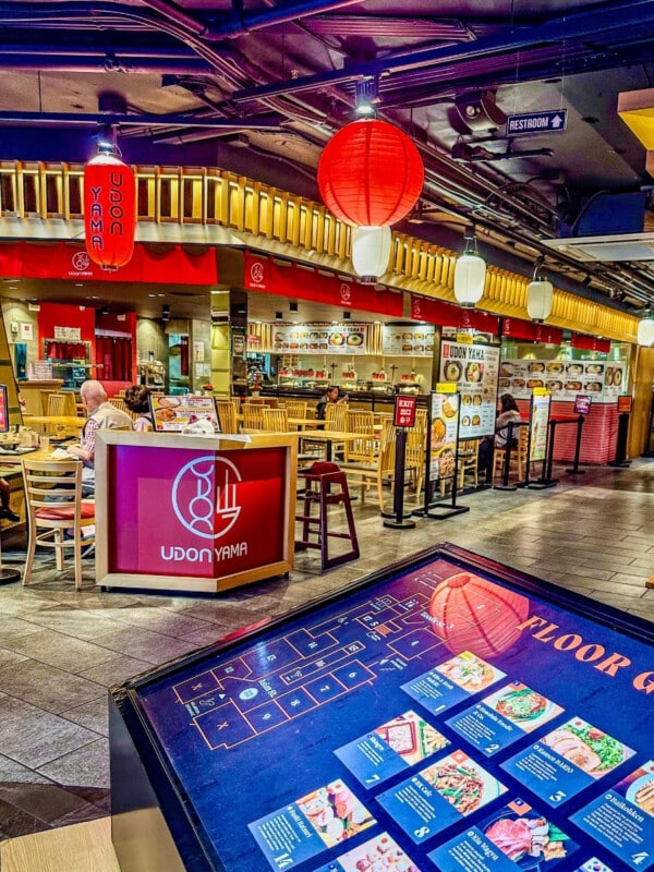 STIX Asia food court with floor plan in foreground and food court setting behind.
