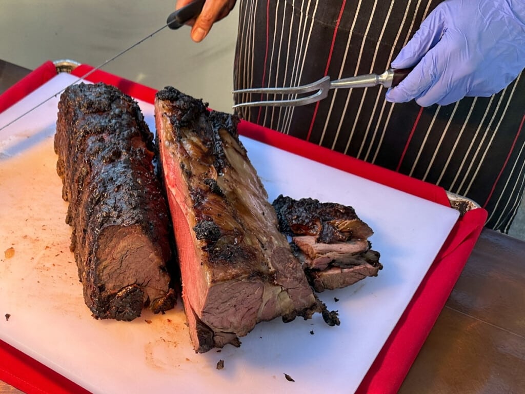 The carving station at Pāʻina Waikīkī Luau with 12 Hour Roasted Prime Rib.