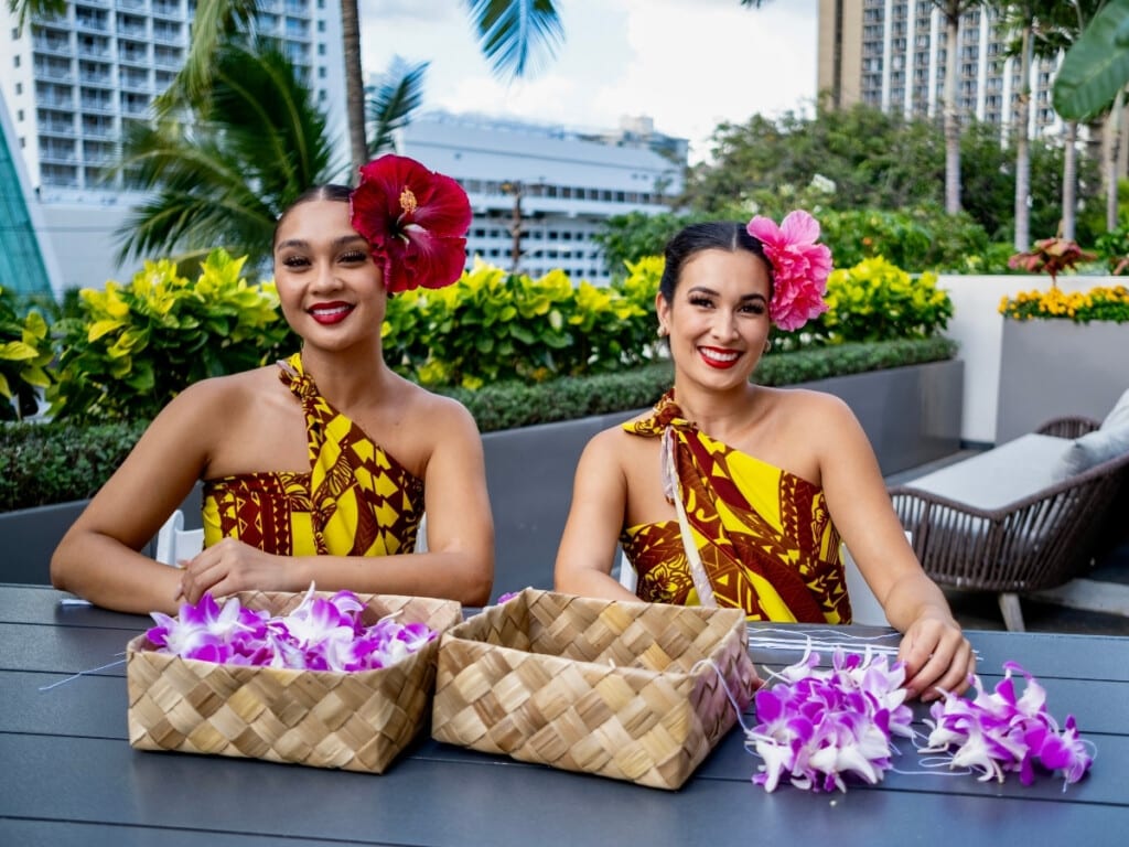 The lei making cultural activity station at the Pāʻina Waikīkī Lūʻau at Waikīkī Beach Marriot.