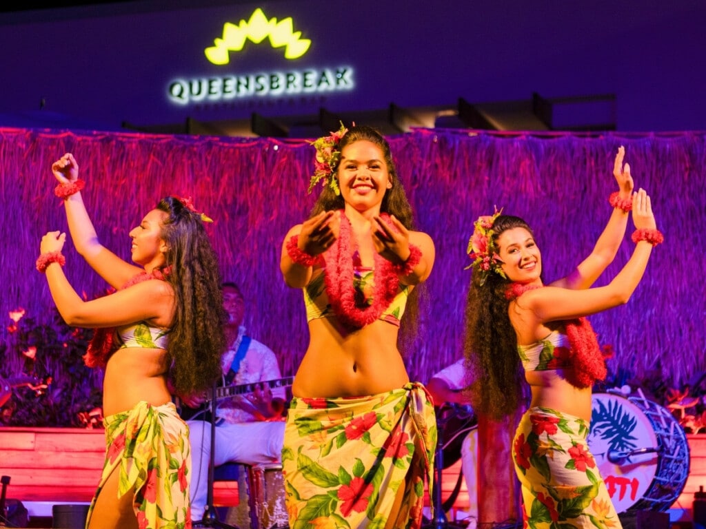 Hula dancers light up the stage with their graceful moves at the the Pāʻina Waikīkī Luau.