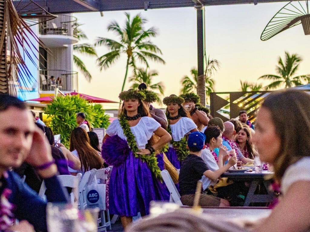 Entertainers move through the audience making the event feel dynamic and interactive at Pāʻina Waikīkī Luau.
