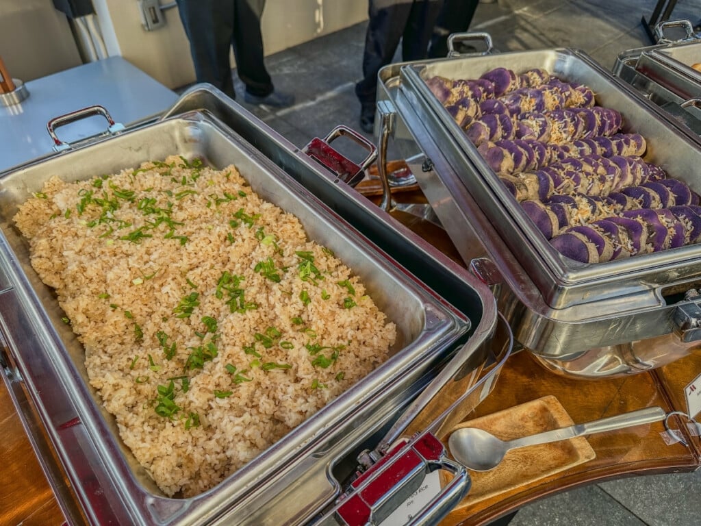 Two bain-maries filled with Island Fried Rice and Taro and Sweet Rolls with Butter at Pāʻina Waikīkī Luau.