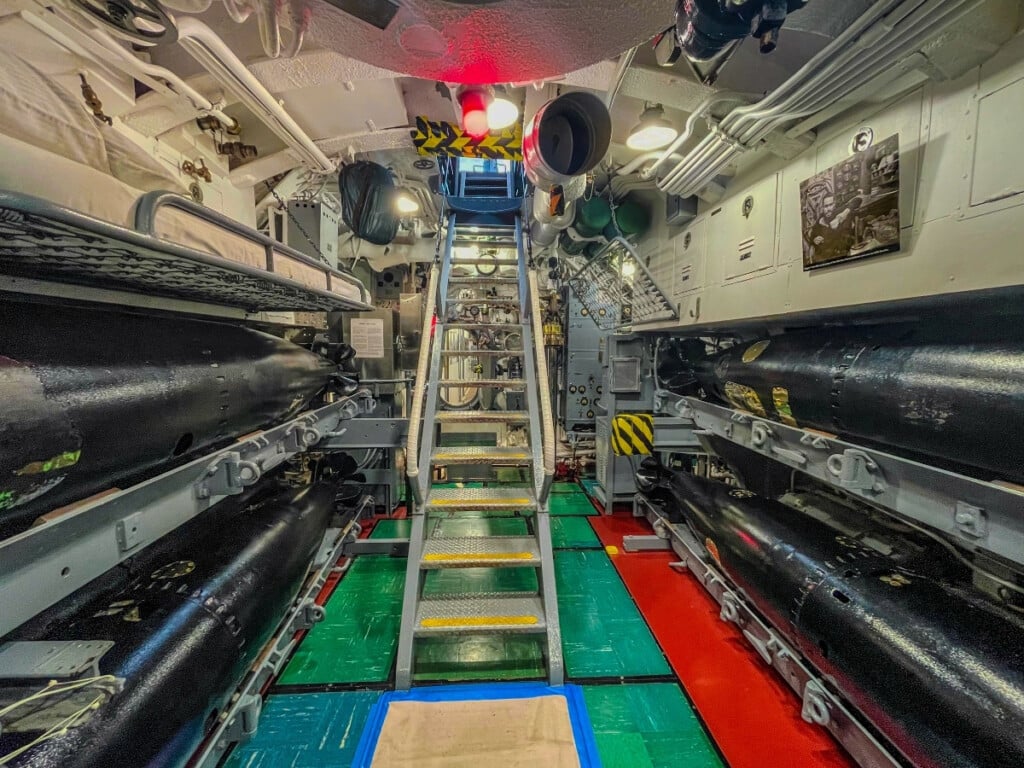 Inside the USS Bowfin Submarine Museum with replica interior and bombs.