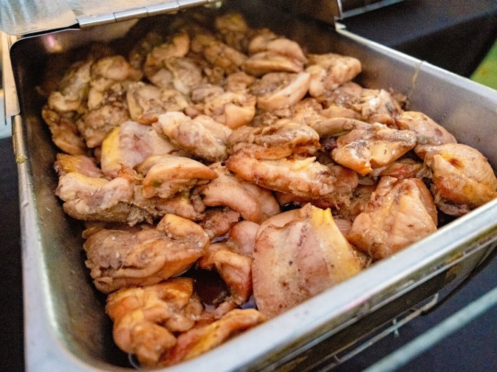 Bain-marie filled with Boneless Teri Chicken from the buffet at the Queens Waikiki Luau.