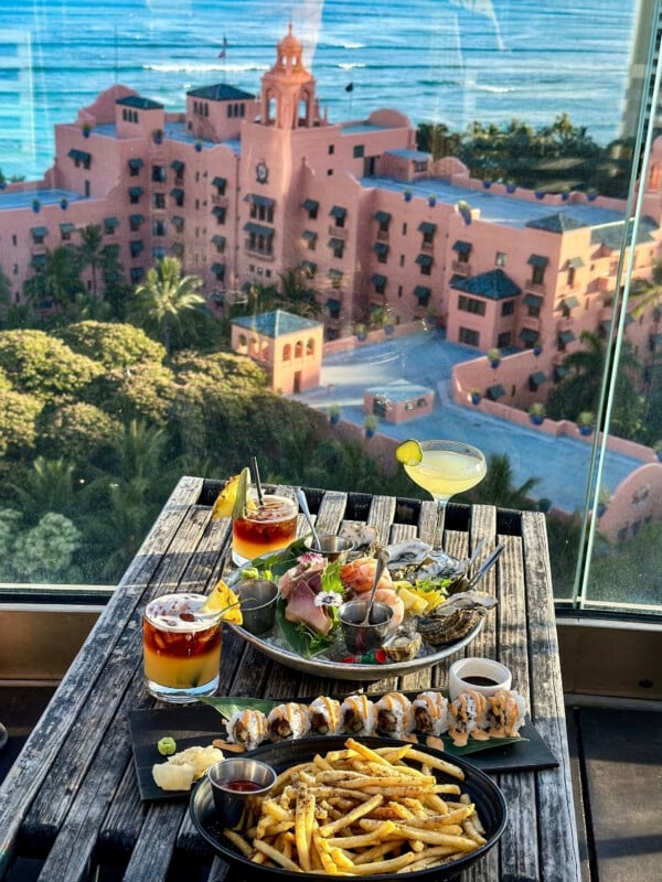 Overlooking Waikīkī's Royal Hawaiian Hotel from Sky Waikiki with a seafood feast with a selection of cocktails.