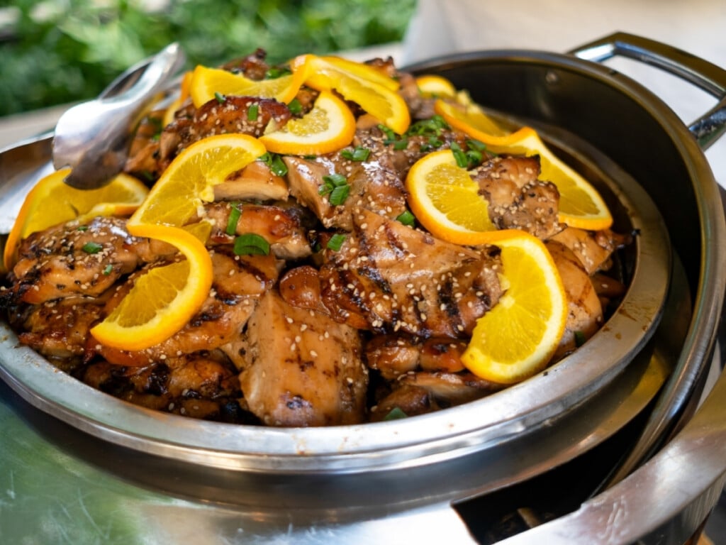 A bowl of large Teriyaki glazed chicken pieces from the Waikiki Luau Buffet & Rock-A-Hula Show.