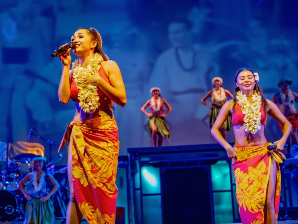 Performers on stage in the Royal Hawaiian Theater.