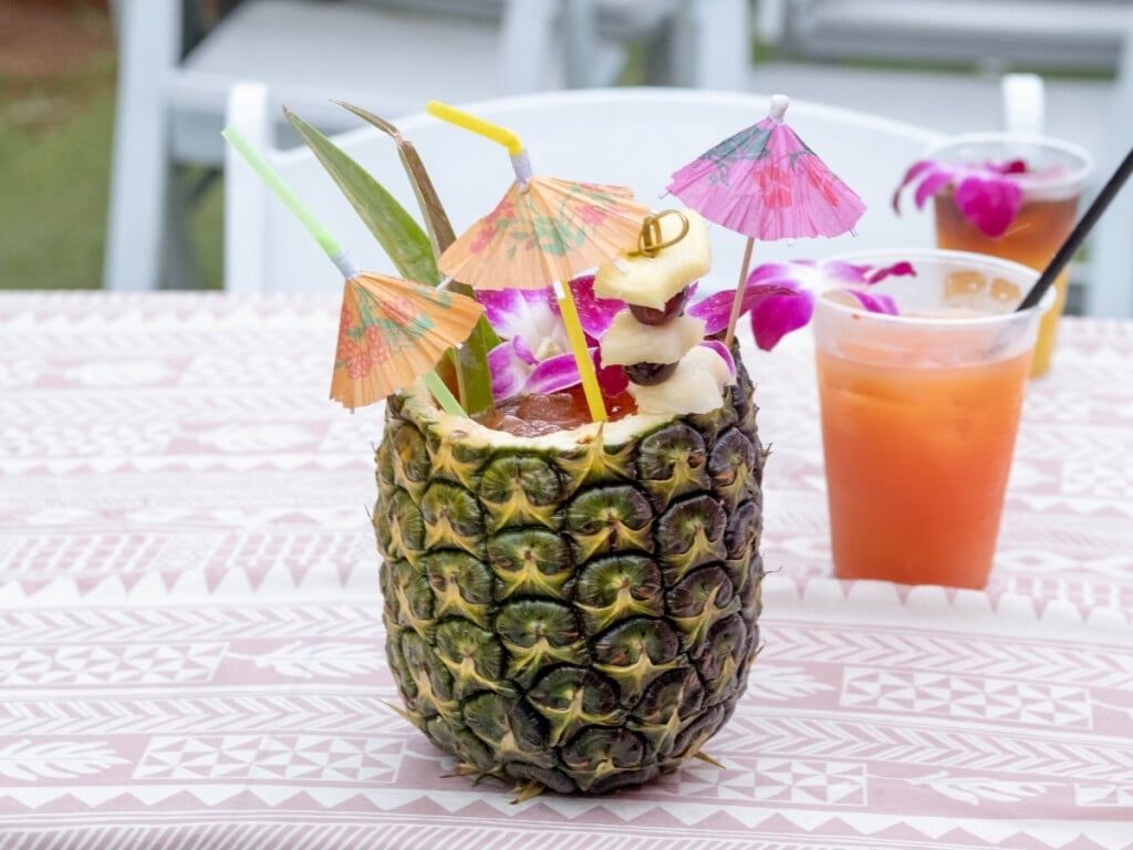 Ka Moana's specialty cocktail with novelty umbrella, a cocktail-in-a-pineapple.