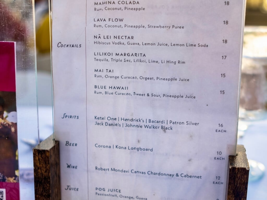 The drinks menu at the Nā Lei Aloha lūʻau which includes cocktails, beer, wine, spirits, and juices priced between $8-$18.