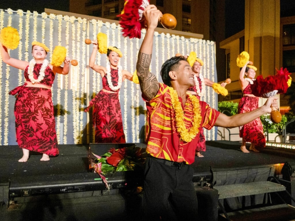An authentic hula performance with traditional Hawaiian instruments.