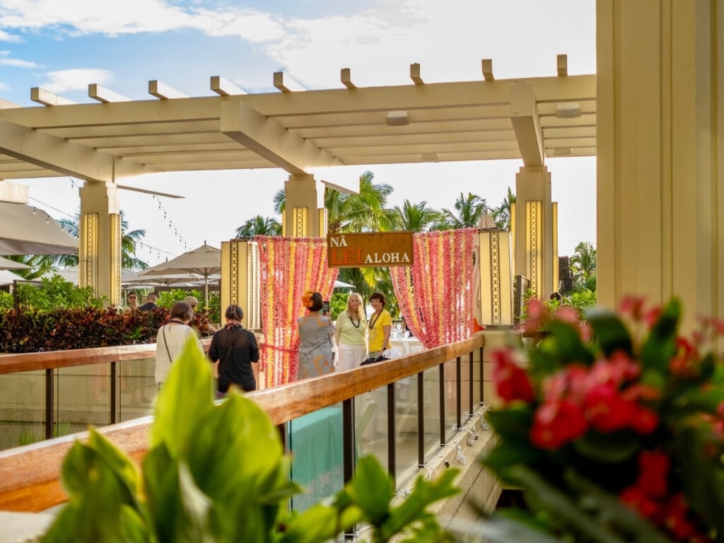 The entrance to Nā Lei Aloha on the third floor of the Hyatt Regency Waikiki Beach Resort with an archway draped in stunning fresh flower lei.