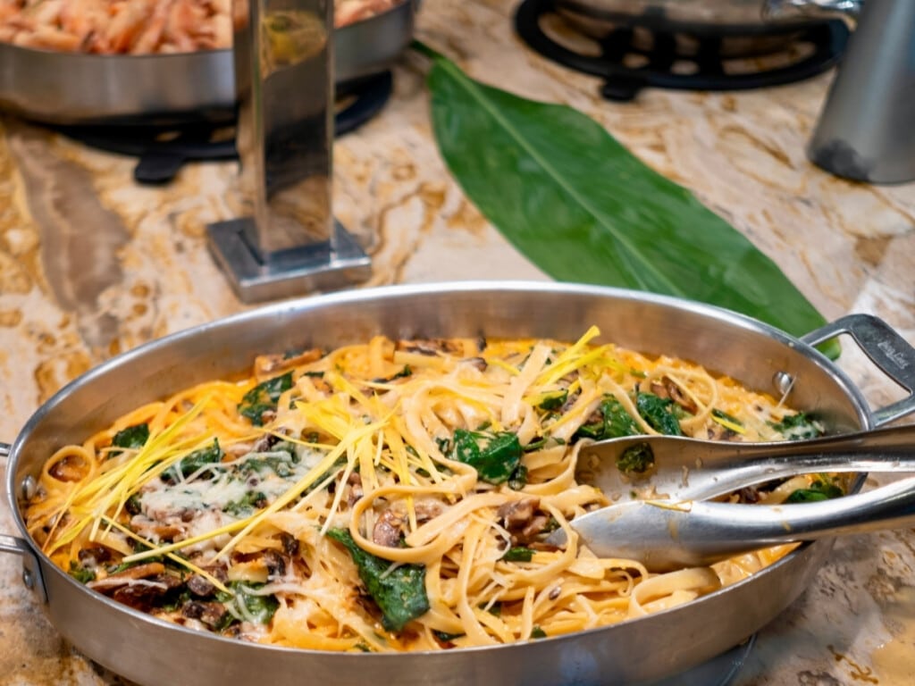 Toowoomba Pasta, a dish at the at the Nā Lei Aloha lūʻau that puts a spicy twist on classic alfredo with a chili-infused creamy sauce.