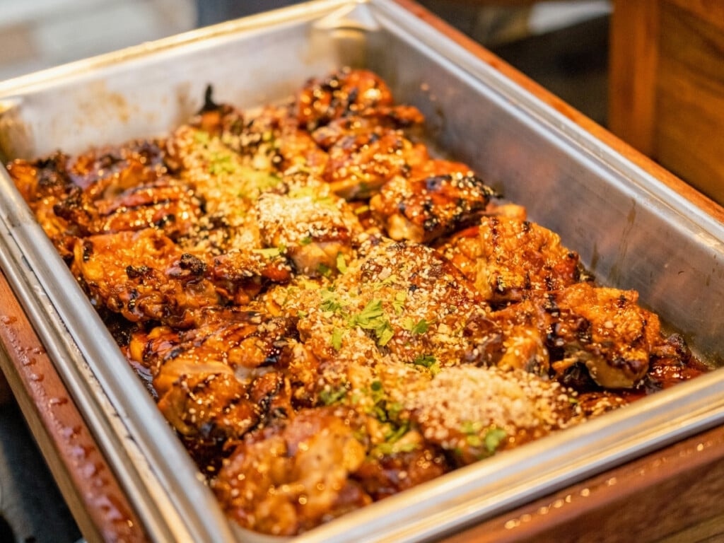 Bain-marie filled with Huli Huli Chicken from the buffet at the Waikiki Starlight Luau: Rooftop.