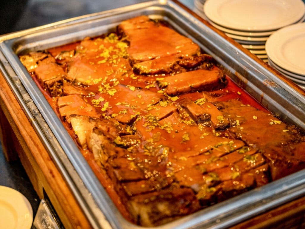 Kiawe Smoked Brisket in Guava BBQ sauce from the buffet at the Waikiki Starlight Luau: rooftop.