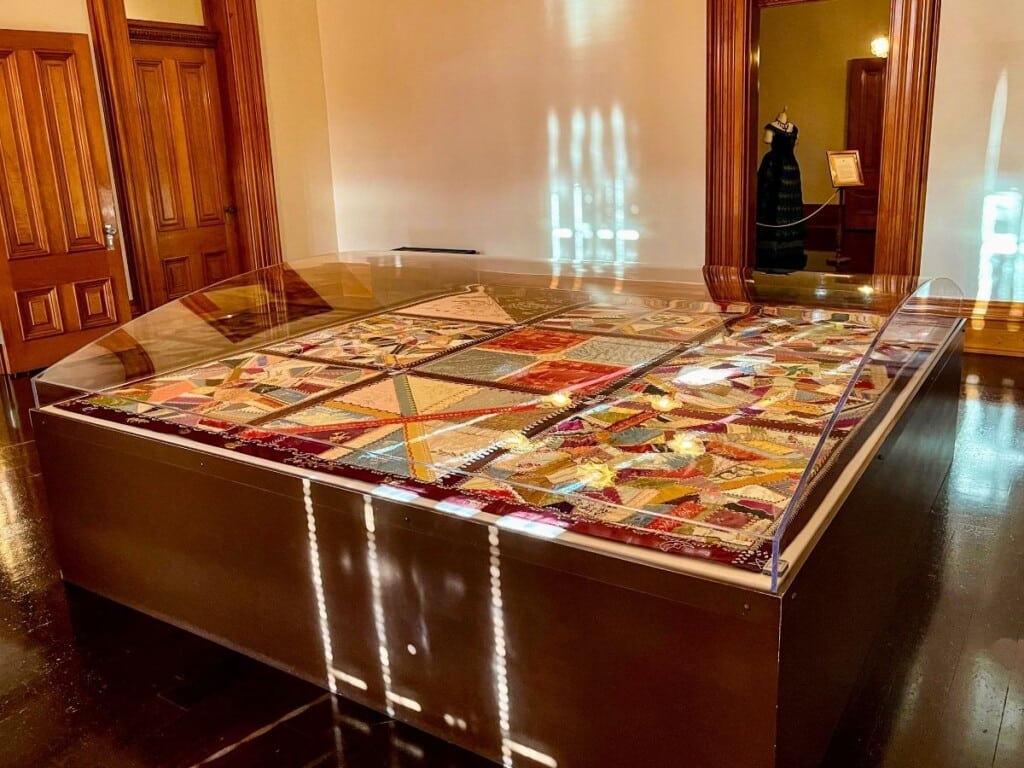 The Imprisonment Room in ʻIolani Palace which displays Queen Liliʻuokalani crochet-work and quilting.